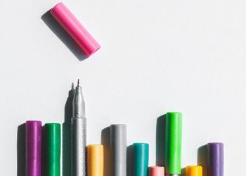stack of pens - Content Marketing: Rise Above the Noise